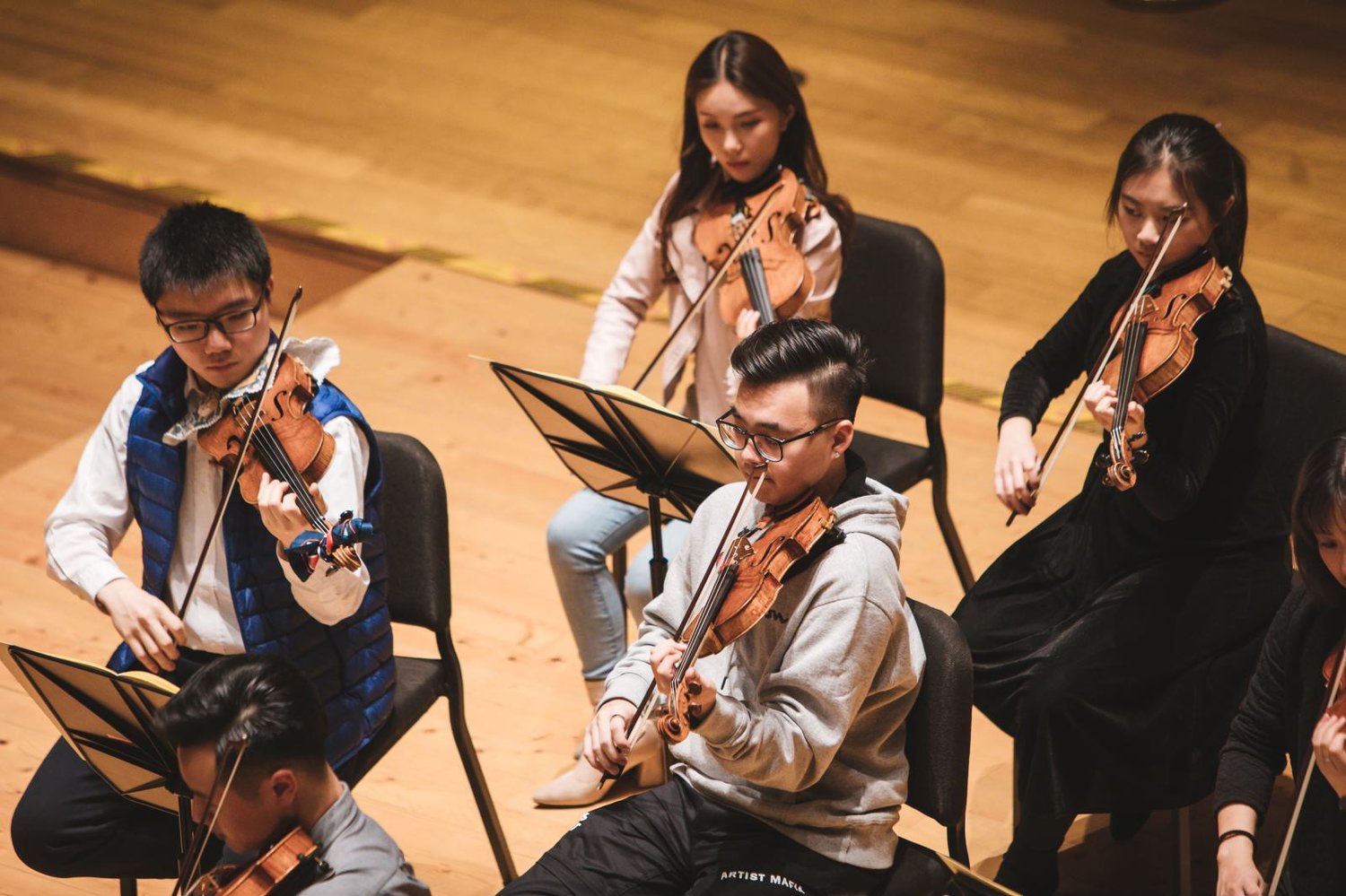Seen in sequence: Benny (holding clarinet), Qiu Sheng, Yi-Ting and Xian Long (frontmost) in rehearsal.