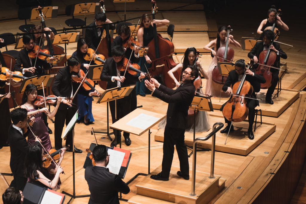 The Conservatory Orchestra's string section in Vaughan Williams's Fantasia on a Theme by Thomas Tallis with Principal Conductor Jason Lai (centre), at the Esplanade Concert Hall.