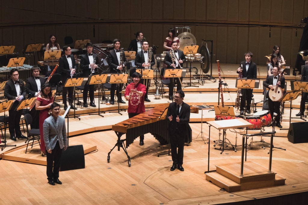 Asst Prof Chen Zhangyi being congratulated after the premiere of his Concerto for Erhu, Zhongruan, Percussion and Ensemble.