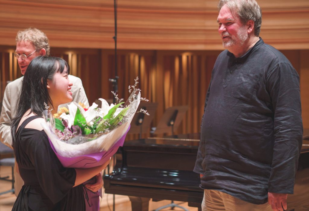 Above: Ho Qian Hui (left) after winning the Concerto Competition on 31 August, being congratulated by Professor Bernard Lanskey, Dean of the Conservatory