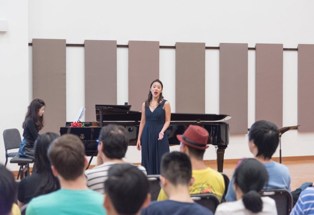 Rachel performing a lecture-recital at the YST Conservatory Orchestra Hall, accompanied by second-year pianist Adriana Chiew
